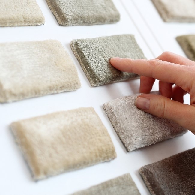 Image depicts samples of carpets for sale in Hamilton.