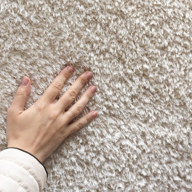 Image depicts a close up of a white carpet for sale in Markham.