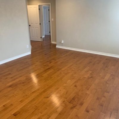 Image depicts a solid hardwood flooring installation project in London, Ontario.
