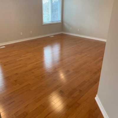 Image depicts a solid hardwood flooring installation project in London, Ontario.