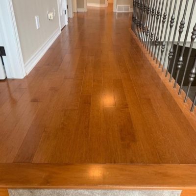 Image depicts a solid hardwood flooring installation project in London, Ontario.