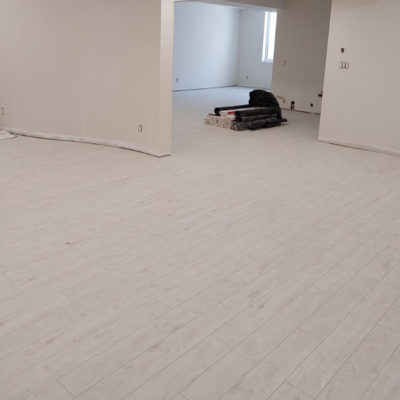 Image depicts new floors from a click vinyl flooring installation project in London, Ontario.
