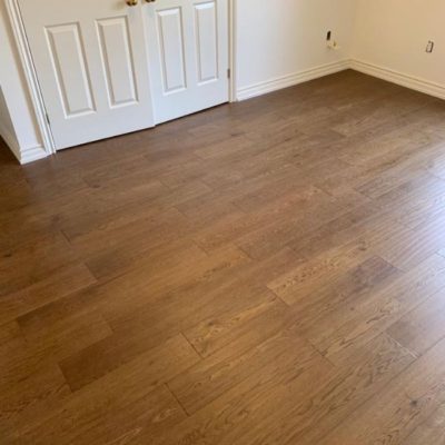 Image depicts newly installed wood floors from a engineered hardwood flooring installation project in London, Ontario.