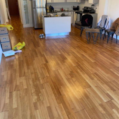 Image depicts old floors from an engineered hardwood flooring installation project in Toronto, Ontario.