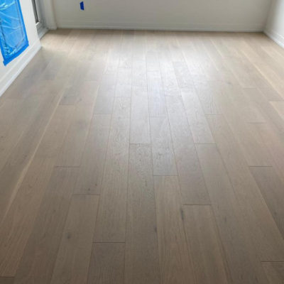 Image depicts new floors from an engineered hardwood flooring installation project in Toronto, Ontario.